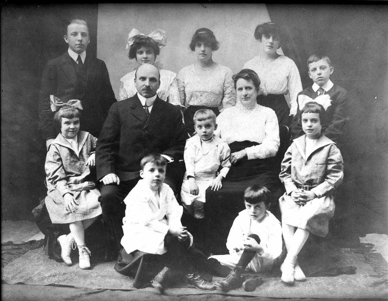   ~~  Front Row:  Eugene and John
 
Middle row:  Alyce, Michael Donohoe, Charles, Anna Sullivan Donohoe, Dorothy
 
Back Row:  Edwin, Mary, Helene, Anna (Nance), Gerald