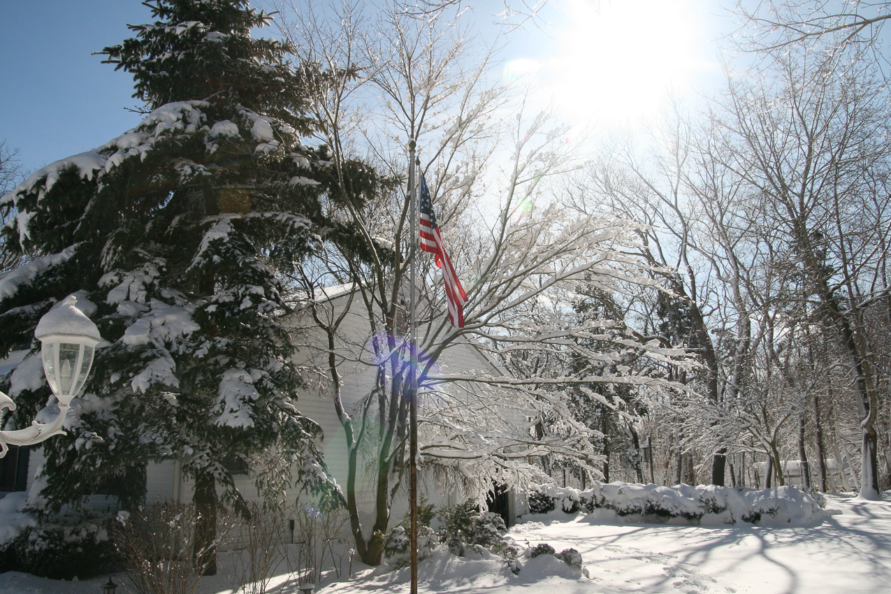 Old glory in her glory  ~~  There is no down side, got some great snow, the kids are warm and playing inside, sun is out, hot soup for lunch......doing some work from the easy chair.....