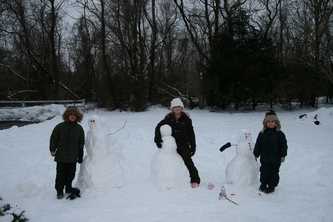 2 snowmen, 1 snowgirl and their creations.  ~~  