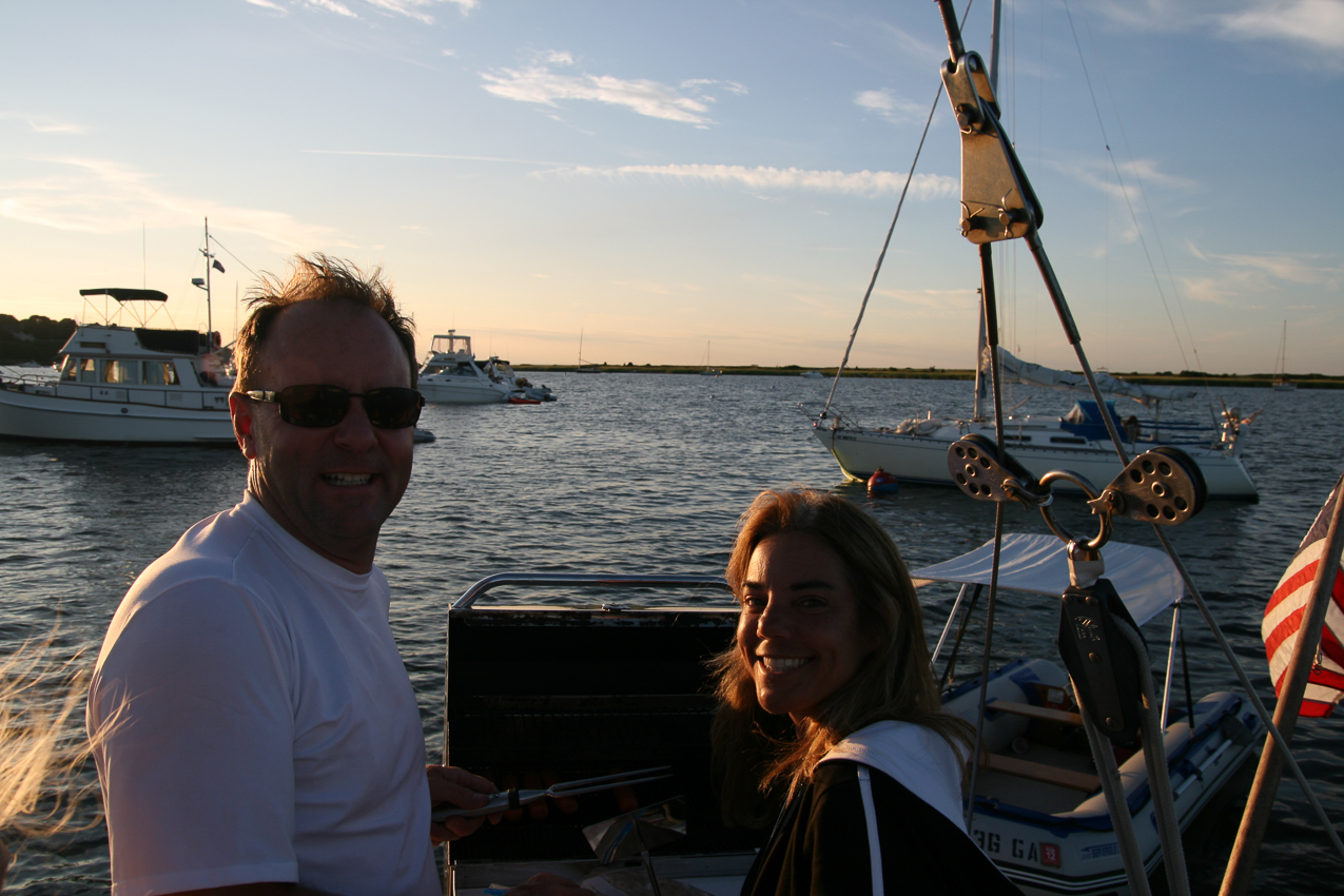 Captain Tom at the grille  ~~  Lisa is making sure I do it right?