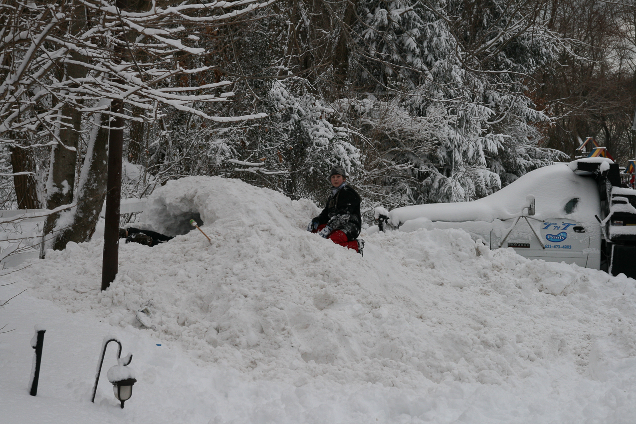 The boys like the mound, but can't get the cars out.  ~~  