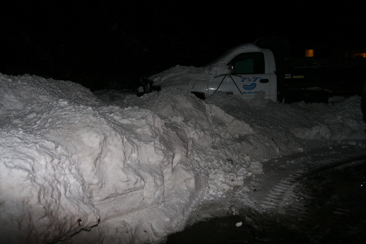 There is that town plow/contractor still out there!  ~~  I got as much as Johnny Deere could handle.  over 5 feet high on the left.  The middle of the picture is the middle of my driveway.  We can squeek by between the snow and mailbox.
