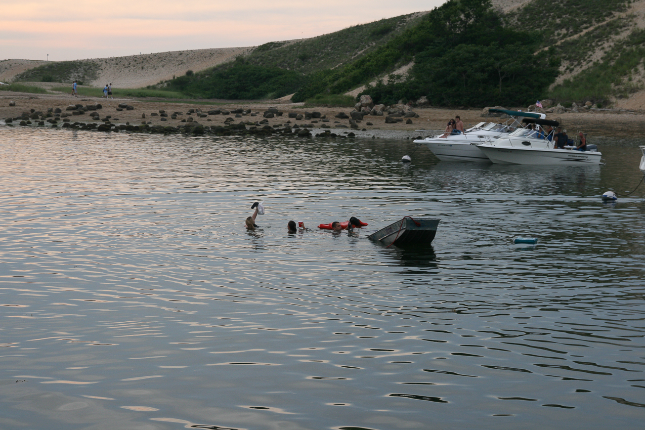 Let's see: bit of drinking, a 12 foot alumin low free board boat, small outboard, 5 girls and 1 guy  ~~  3 girls in front try to get better seating and swamp the bow of the boat?????   Called sinking!