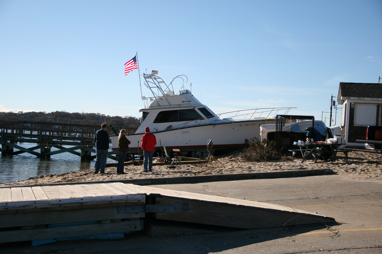 Hurricane Sandy come to town Nov 2012  ~~  surge high tide, broken mooring, huge wiind, and there you go!  Beached Egg Harbor.  (too almost 2 weeks to get her off)