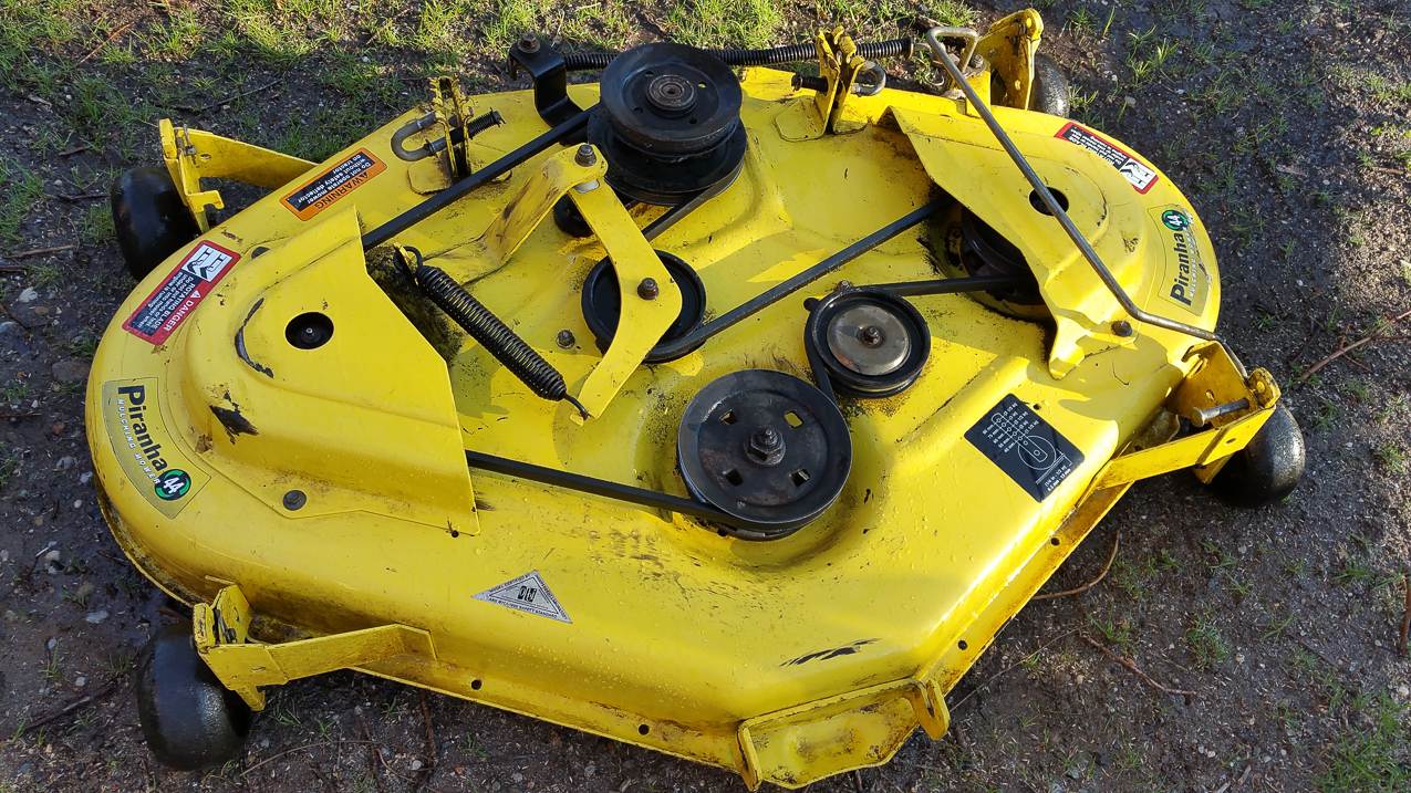 1/4 century old Piranha mowing deck  ~~  Of course worked so well and lasted so long - discontinued by John Deere.