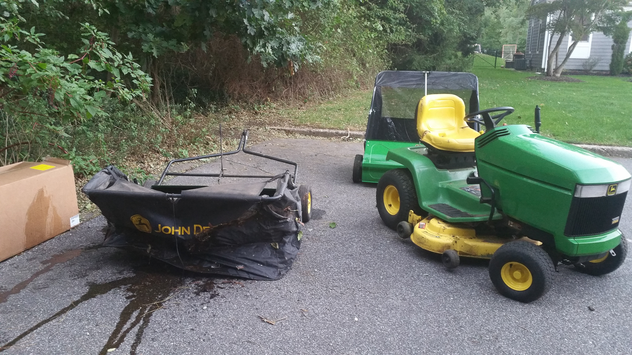 out with the old - 12 years old and tons of leaves.  ~~  NOTHING runs like a Deere.  i beat the crap outta that things.