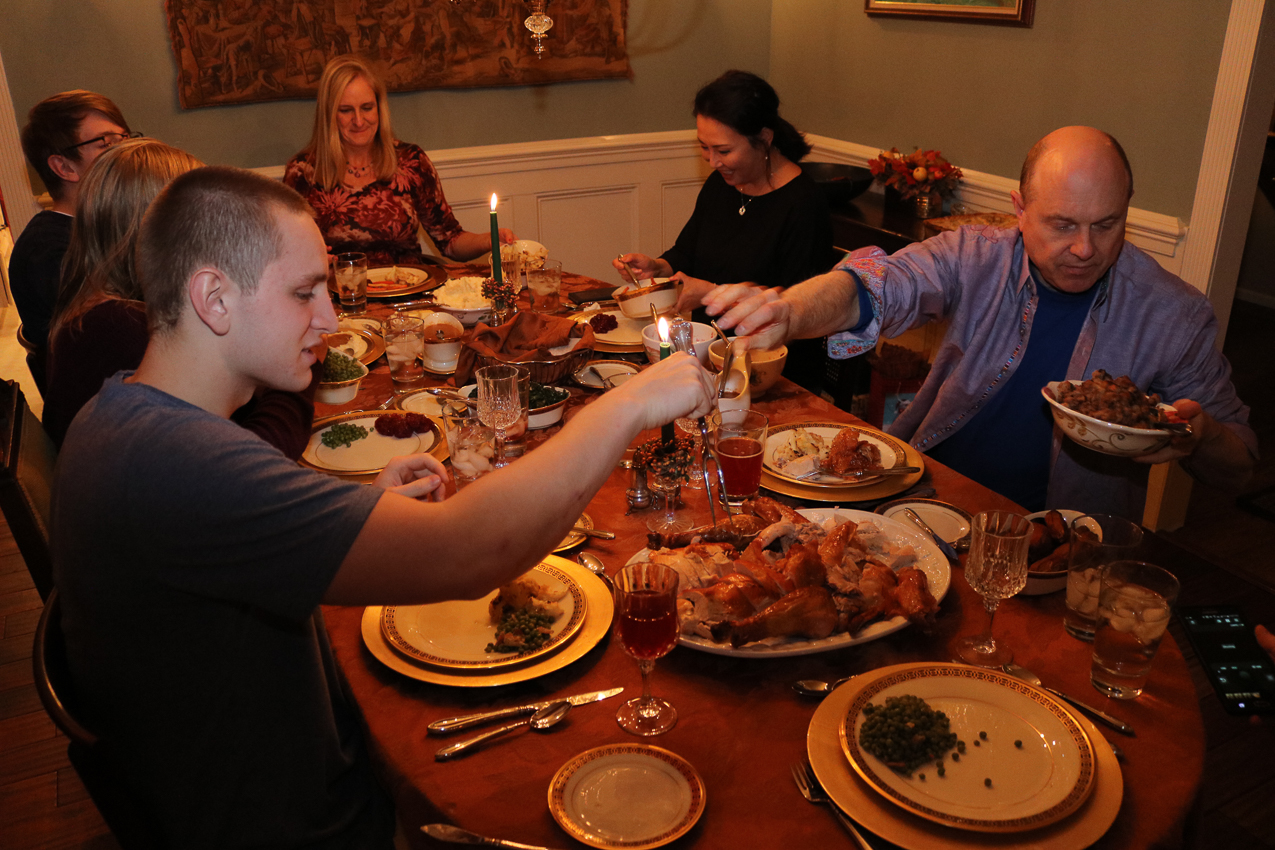 Chez Gretchen - NOBODY does it better.  Something for EVERYBODY  ~~  8 serving spoons needed.  Turkey, stuffing, 2 types of  cranberry sauce, sweet potato, butternut squash/spinach, mashed potatoes, gravy, peas, carrots (2 kinds), dinner rolls, collards and onions.......... and dessert?  Homemade butter pecan and vanilla ice cream, Gret's aweseome apple pie, and a pumpkin cheesecake.   OMG