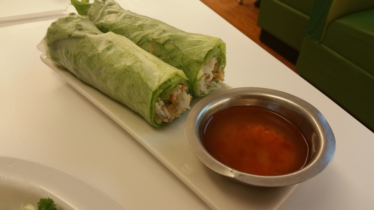 Some lettuce wrapped in rice paper with shaved coconut.  ~~  