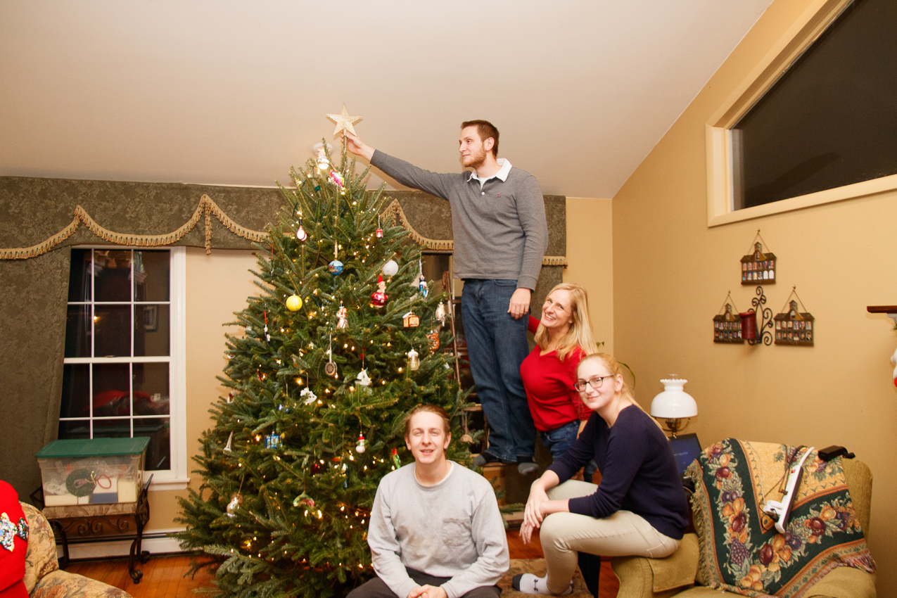 Setting the star of the Lynch Christmas Tree  ~~  Dan gets the honor, leaving for Thailand again for 3 months.