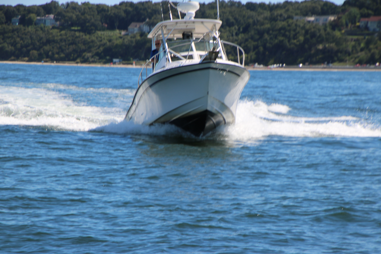 Labor Day Satruday with the Shibi, Thompsons, and Barry's all boating in J PJ Harbor  ~~  During my Race they came over the shame me.