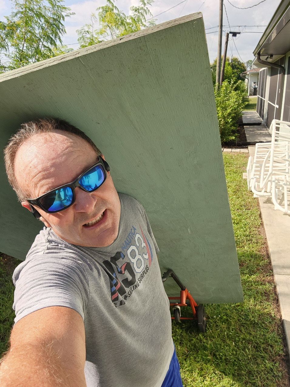Working at MomMoms in 109F heat index heat taking down the storm shutters  ~~  