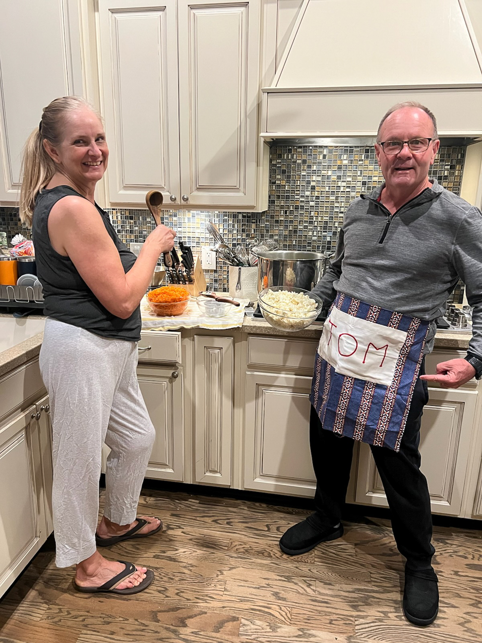 Gret and Tom in the kitchen  ~~  Tom has Ginny Derough's deceased husband Tom's apron she gave me.