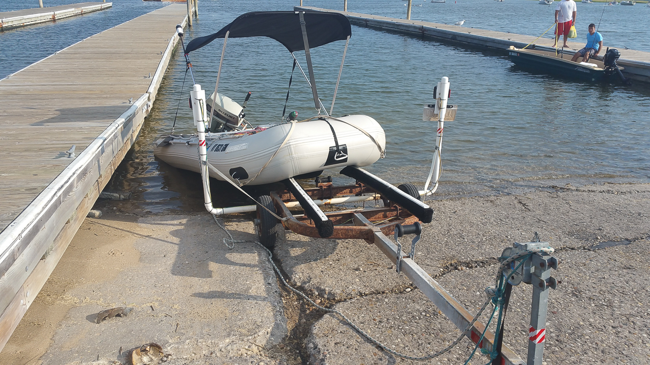 town of Brookhaven broke my trailer!!!  ~~  here is my dingy actually bounced off the trailor and landed on the ramp with the engine.