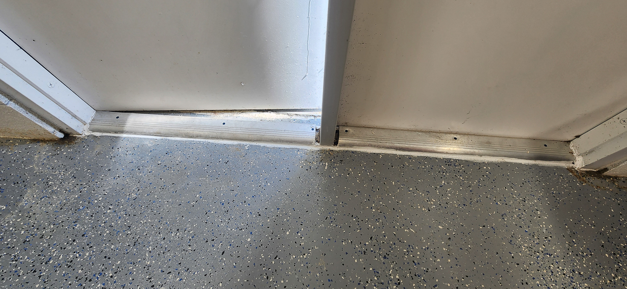 Storage West Door Threshold wet and open : US Coast Guard Venice Mission Support & Training Center September 2025  ~~  Storage Building Roof and Door leaks