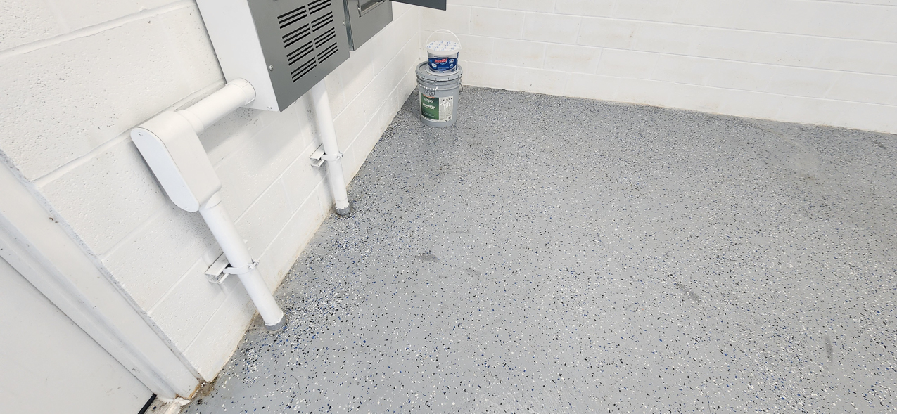 Storage East significant water aound the buidling: US Coast Guard Venice Mission Support & Training Center September 2025  ~~  Storage Building Roof and Door leaks