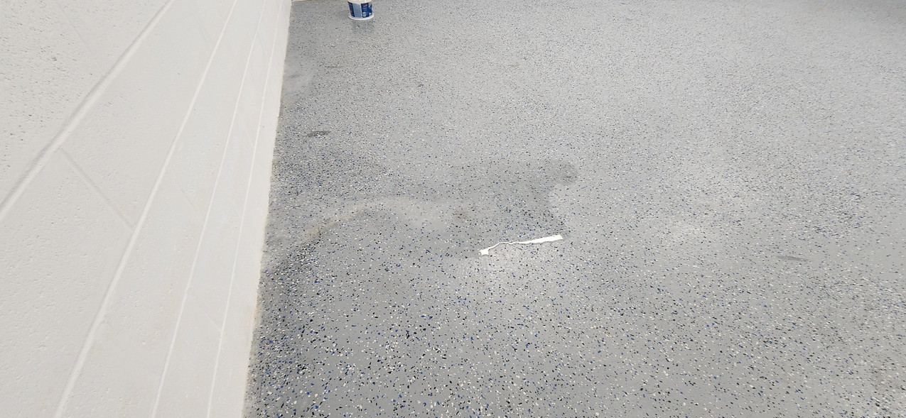 Storage East significant water aound the buidling: US Coast Guard Venice Mission Support & Training Center September 2025  ~~  Storage Building Roof and Door leaks