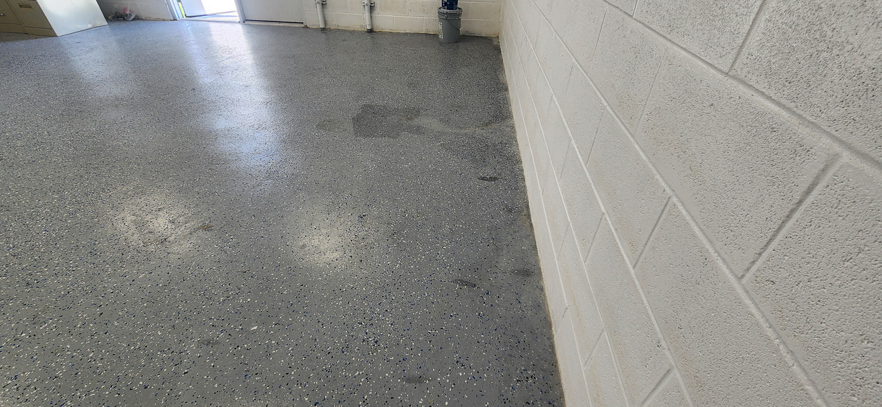 Storage East significant water aound the buidling: US Coast Guard Venice Mission Support & Training Center September 2025  ~~  Storage Building Roof and Door leaks