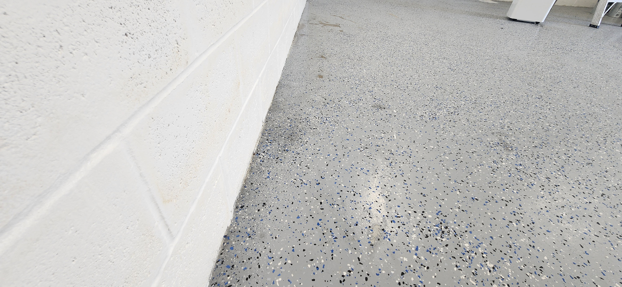 Storage East significant water aound the buidling: US Coast Guard Venice Mission Support & Training Center September 2025  ~~  Storage Building Roof and Door leaks